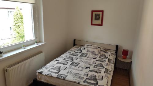 Postel nebo postele na pokoji v ubytování Apartament przy Wrocławskim Stadionie