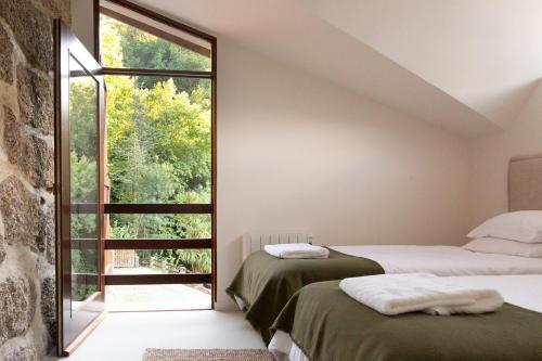 Postel nebo postele na pokoji v ubytování Casa Soenga