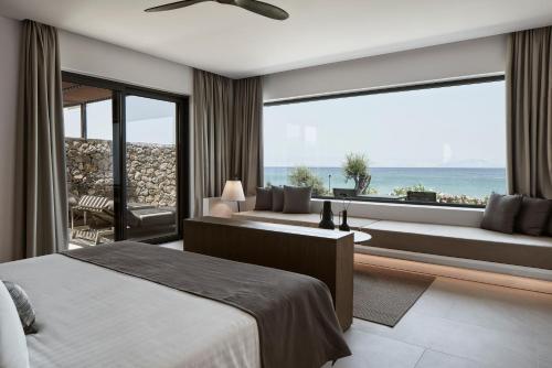 Postel nebo postele na pokoji v ubytování The Olivar Suites