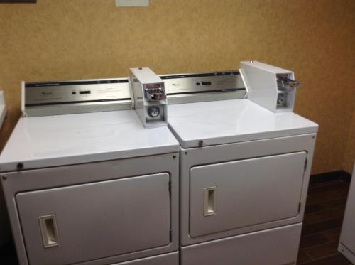 two washing machines sitting next to each other in a room at Canal Park Lodge in Duluth