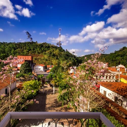 a view of a town with trees and buildings at Hotel Montenegro Guaramiranga in Guaramiranga