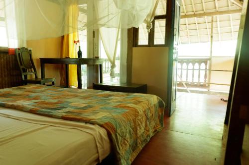 Кровать или кровати в номере Khaama Kethna Eco Sustainable Village