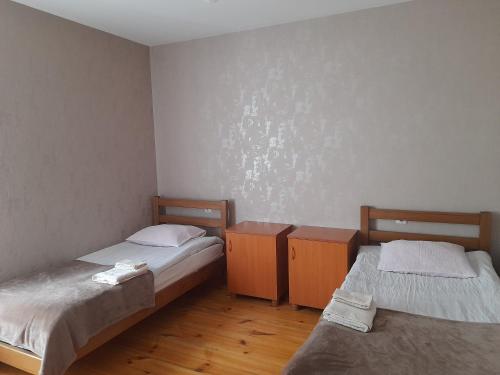 Postel nebo postele na pokoji v ubytování Kera Guest House