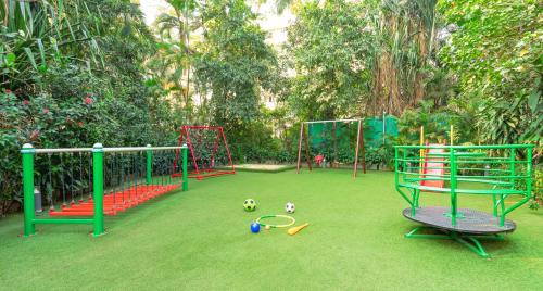 a playground with soccer balls and equipment on the grass at Taj Wellington Mews, Mumbai in Mumbai
