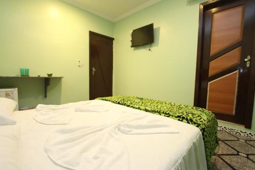 Una cama o camas en una habitación de Hotel Lagoa