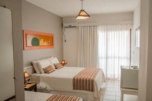 Postel nebo postele na pokoji v ubytování Cahy Praia Hotel