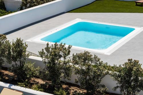 Πισίνα στο ή κοντά στο Kyklos Villas - luxury villas with private pool