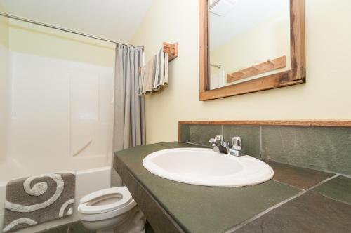 a bathroom with a sink and a toilet at Riding Fool Accommodation in Cumberland