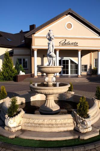 a large fountain in front of a building at Dworek Jolanta in Biała Podlaska