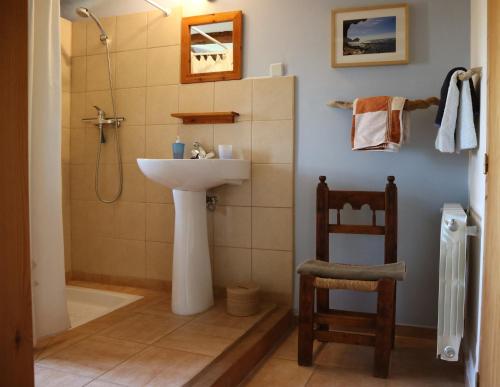 a bathroom with a sink and a shower at B&B Casa Rural Mas de las Tapias in Valderrobres
