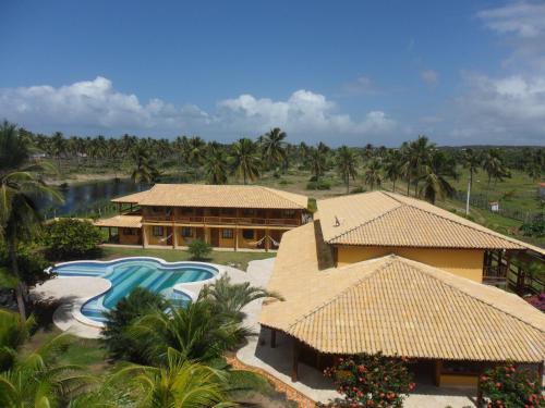 an aerial view of a resort with a swimming pool at Pousada Anga in Baixio