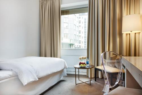 Postel nebo postele na pokoji v ubytování Hotel Riverton