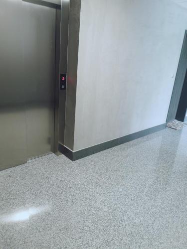 a door in a room with a tile floor at Apartament Źródełko in Bochnia