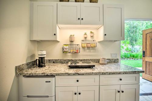 a kitchen with white cabinets and a counter top at Rancho Santa Fe Casita - Gate Guarded Community! in Rancho Santa Fe