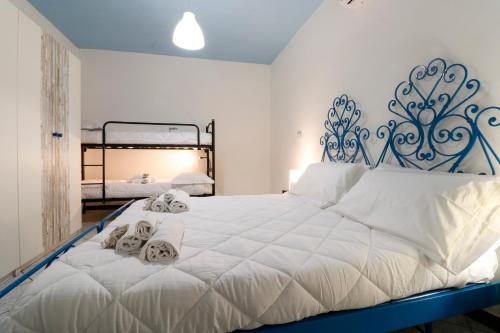 CasaViva - Grande bilocale a Genova Porto Antico tesisinde bir odada yatak veya yataklar