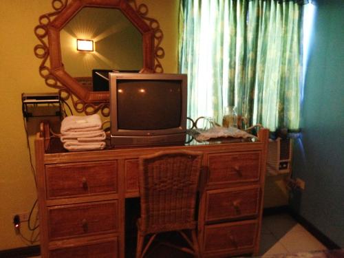 Telewizja i/lub zestaw kina domowego w obiekcie RM Guest House