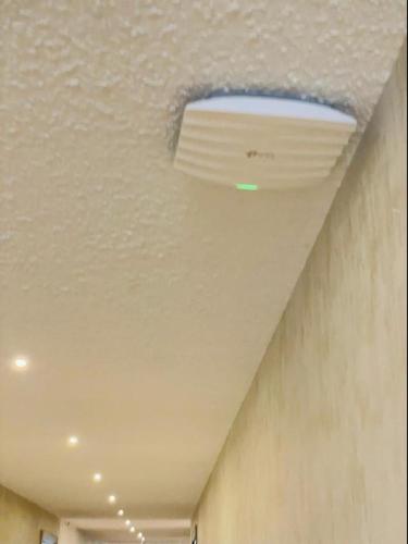 a light on the ceiling of a room at Royal Ace Boutique Hotel in Bengaluru