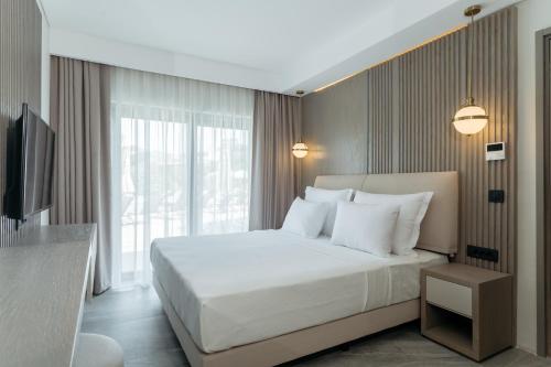 En eller flere senger på et rom på Bodrum Astrid Hotel