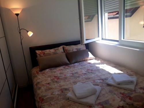 Giường trong phòng chung tại Apartman RADOVIĆ