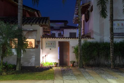 a house with a door at night at Pousada Casario in Paraty