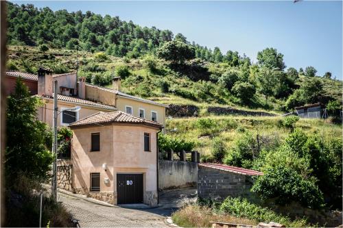 a house on the side of a hill at Ciudad Encantada Tio Daniel in Valdecabras