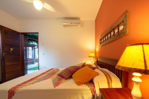 מיטה או מיטות בחדר ב-Pousada Casario