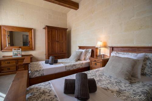 Ένα ή περισσότερα κρεβάτια σε δωμάτιο στο Mandolina Casa