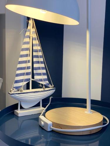 a model boat on a table in a room at BedRoom Spiaggia di Ponente in Milazzo