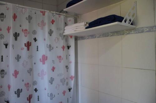 a shower curtain in a bathroom with a shower at Casa Quinta Marie Rose in Mercedes