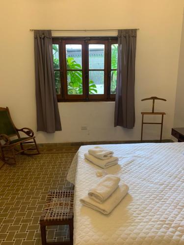 En eller flere senger på et rom på Casona Leguizamon