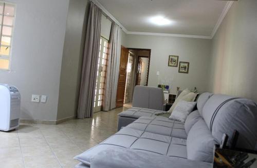 a living room with two couches and a couch at RECANTO JK in Taguatinga