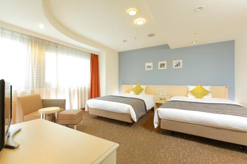 Postel nebo postele na pokoji v ubytování HOTEL MYSTAYS Utsunomiya