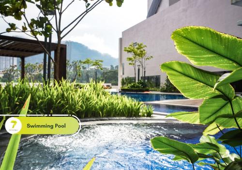 a swimming pool in a building with plants at 7Stonez Residences Midhills Genting Highlands in Genting Highlands