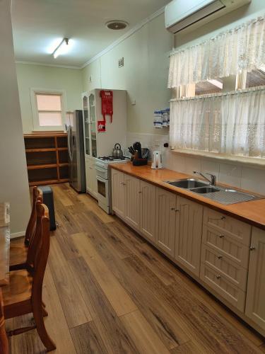 a kitchen with a sink and a counter top at Skytrek Willow Springs Station in Flinders Ranges