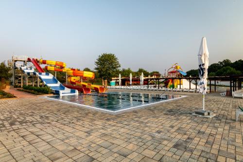 a water park with a water slide and a pool at Villa Trakia in Simeonovo