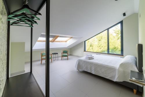 Een bed of bedden in een kamer bij Apartamentos Rurales La Gloria de Yuste