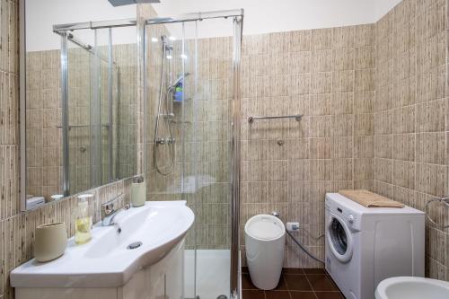 a bathroom with a shower and a toilet and a sink at Sorrento centre Home with amazing view terraces in Sorrento