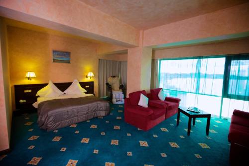 Una cama o camas en una habitación de Hotel Delta 4