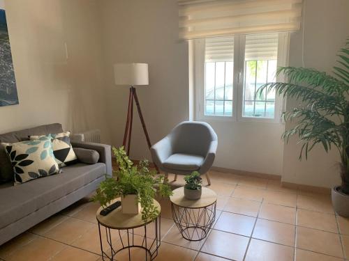 a living room with a couch and a chair at Casa Rural San Francisco II in Siles