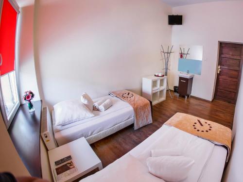 Postel nebo postele na pokoji v ubytování Boutique Hostel