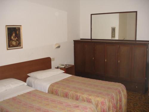 Postel nebo postele na pokoji v ubytování Hotel La Rusticana