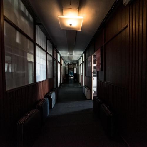 a hallway in a building with a light on the ceiling at Adventure Alternative - GUEST HOUSE - Arts-Factory-Experience - For artists, makers and open minds - Attention, we are not a hotel and are not adapted for everybody - Read host warnings before reservation - PROVIDENCE,BE asbl in Charleroi