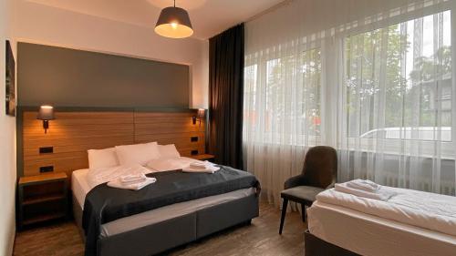 a hotel room with a bed and a window at MB Hotel in Bremen