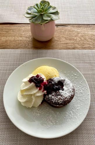 two donuts on a white plate on a table at Chata Tale - Dom Horskej služby in Tale