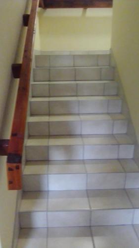 a set of stairs in a building at Emampingeni lodge in Bizana