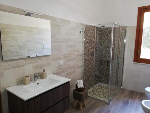 a bathroom with a sink and a shower at Il Volo Dei Gabbiani in Scopello