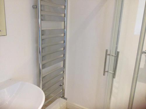a bathroom with a shower and a sink at Breeze Place in Nelson