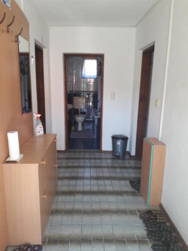 an empty room with a hallway with a bathroom at Hostel Topić in Banja Luka