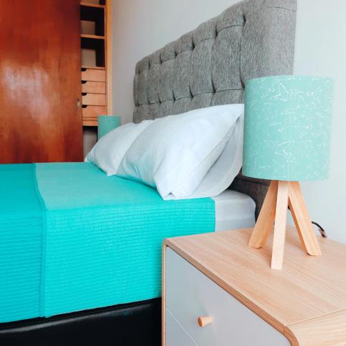 Ένα ή περισσότερα κρεβάτια σε δωμάτιο στο eSuites San Nicolás de Bari 218