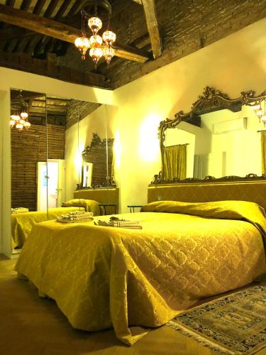 a bedroom with a large bed with a large mirror at Ca Dode Grand Canal in Venice